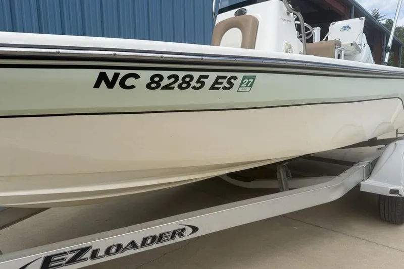 Slide: The Image of 2021 Sea Born FX21 Bay boat on EZ Loader trailer, registration NC 8285 ES. - 6