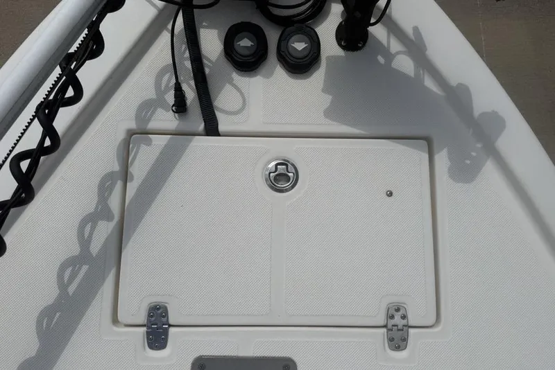 Slide: The Image of 2021 Sea Born FX21 Bay boat deck with storage hatch and control panel. - 7