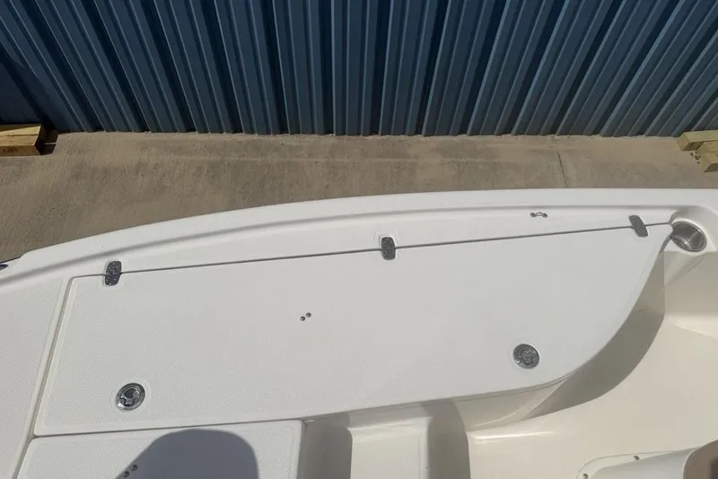 Slide: The Image of 2021 Sea Born FX21 Bay boat deck with storage compartments and cup holder. - 8