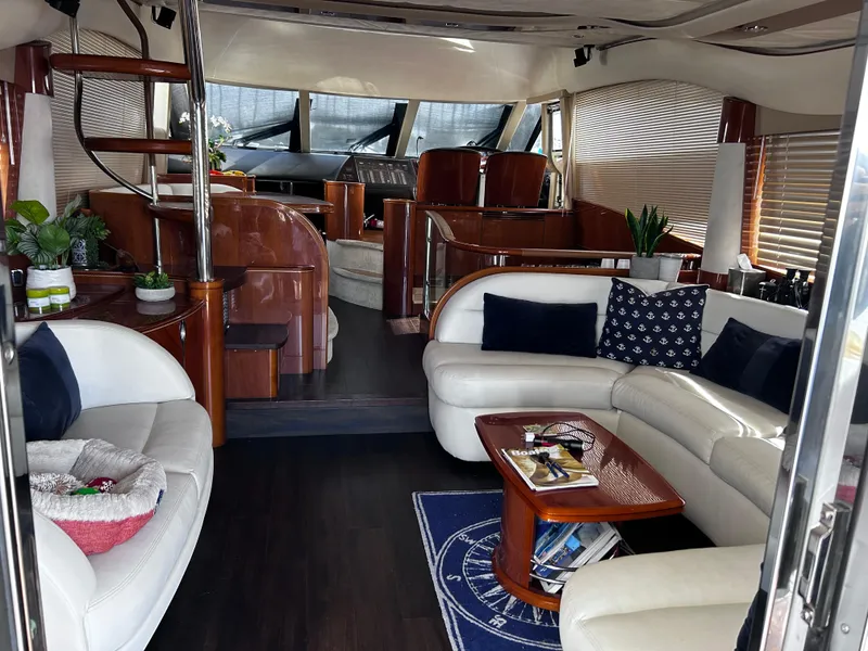 Slide: The Image of Luxurious 2006 Viking Princess 61 Flybridge yacht interior with elegant seating and modern decor. - 11