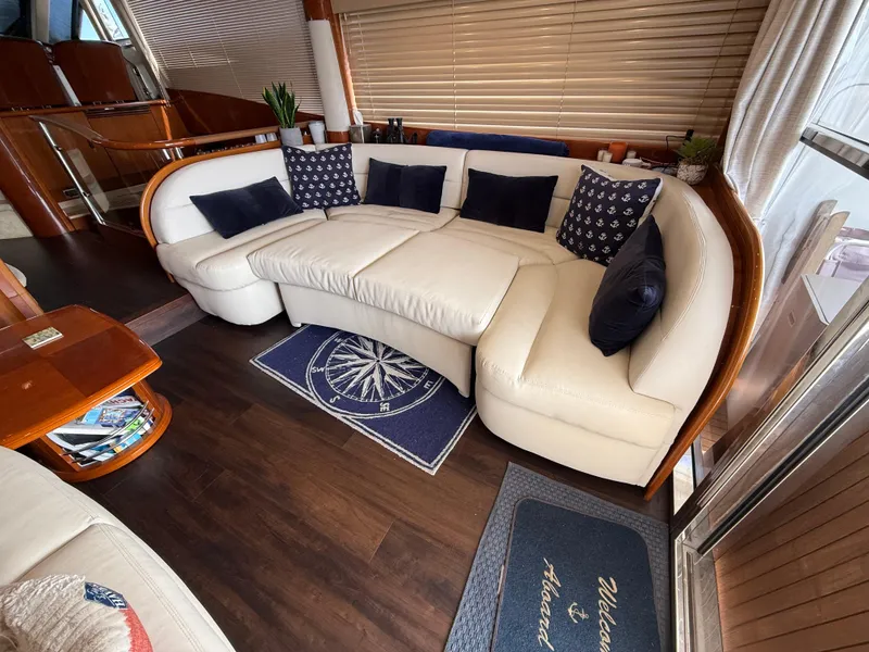 Slide: The Image of Luxurious interior of 2006 Viking Princess 61 Flybridge yacht with elegant seating and decor. - 13