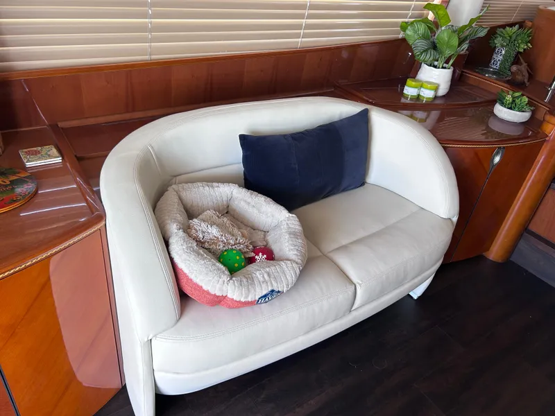 Slide: The Image of Luxurious interior of 2006 Viking Princess 61 Flybridge with cozy seating and decor. - 14