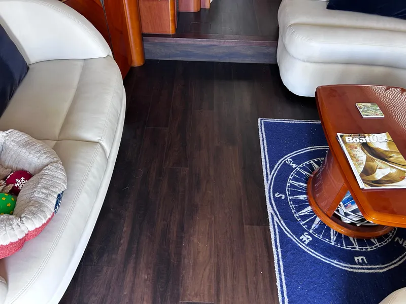 Slide: The Image of Interior of 2006 Viking Princess 61 Flybridge with leather seating and nautical-themed decor. - 15
