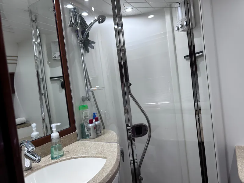 Slide: The Image of Luxurious bathroom in 2006 Viking Princess 61 Flybridge yacht with modern shower and sink. - 28