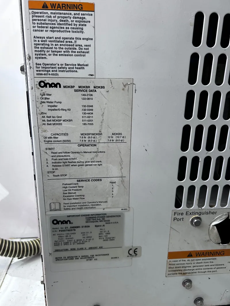 Slide: The Image of Onan generator service data label on Viking Princess 61 Flybridge, 2006 model. - 37