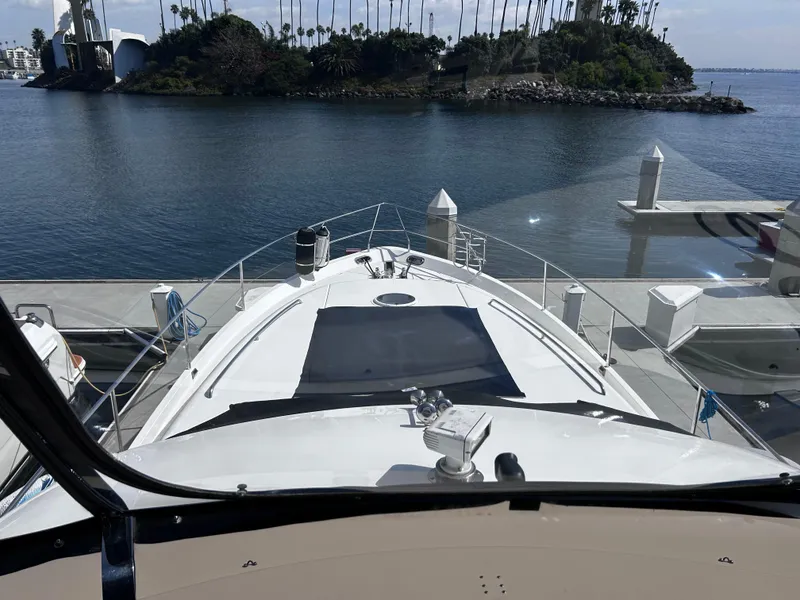 Slide: The Image of Viking Princess 61 Flybridge yacht docked at marina, 2006 model, scenic water view. - 4