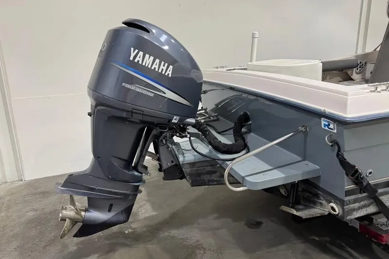 Slide: The Image of 1997 Grady-White Seafarer 228 boat cockpit with steering wheel and seating. - 11