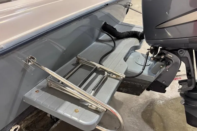 Slide: The Image of 1997 Grady-White Seafarer 228 boat interior with steering wheel and seating. - 12