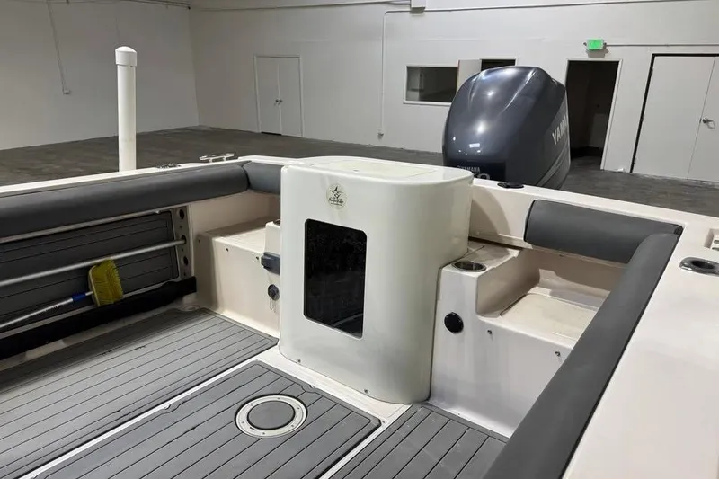 Slide: The Image of 1997 Grady-White Seafarer 228 boat interior with Yamaha engine in a spacious garage. - 15