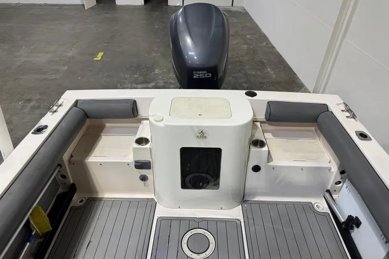 Slide: The Image of 1997 Grady-White Seafarer 228 boat interior with Yamaha 250 engine in a garage. - 16