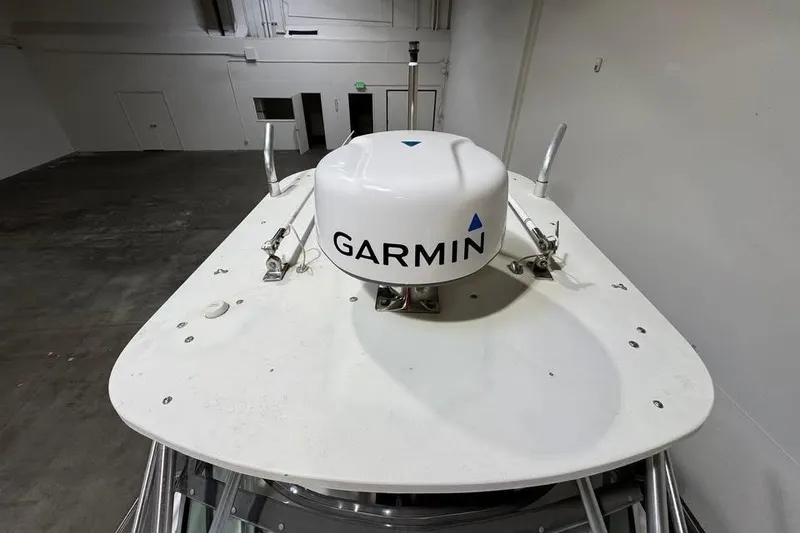 Slide: The Image of 1997 Grady-White Seafarer 228 boat with Garmin radar system in a warehouse. - 17