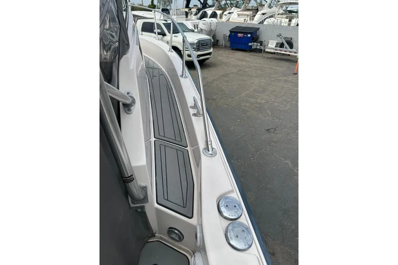 Slide: The Image of 1997 Grady-White Seafarer 228 boat deck with sleek design and sturdy railings. - 20
