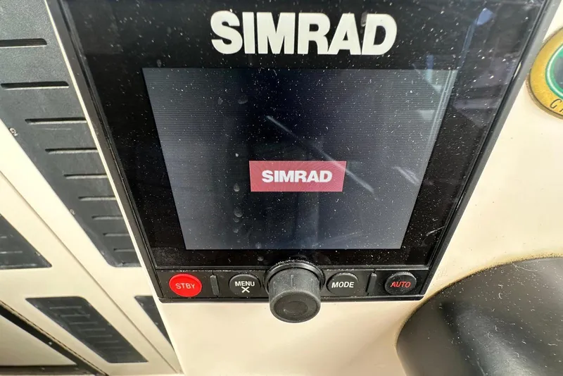 Slide: The Image of Simrad marine display on 1997 Grady-White Seafarer 228 boat dashboard. - 27