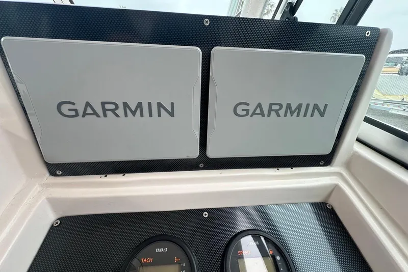Slide: The Image of Garmin navigation system on 1997 Grady-White Seafarer 228 boat dashboard. - 28