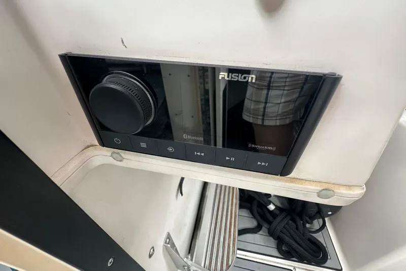 Slide: The Image of Fusion stereo system on a 1997 Grady-White Seafarer 228 boat dashboard. - 29