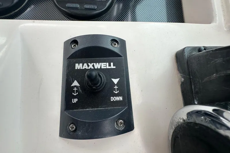 Slide: The Image of Maxwell anchor control switch on 1997 Grady-White Seafarer 228 boat dashboard. - 31