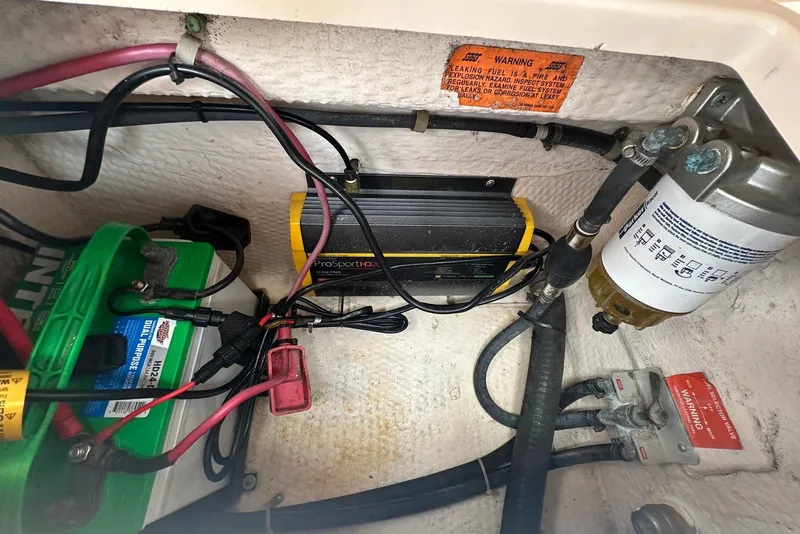 Slide: The Image of 1997 Grady-White Seafarer 228 boat battery compartment with wiring and ProSportHD20 charger. - 33