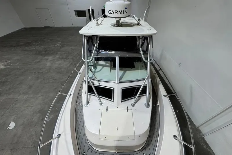 Slide: The Image of 1997 Grady-White Seafarer 228 boat with Garmin equipment in a spacious indoor setting. - 9