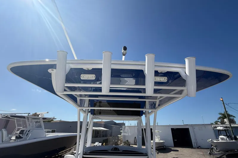 Slide: The Image of 2025 Bluewater 25t boat with T-top under clear blue sky. - 15