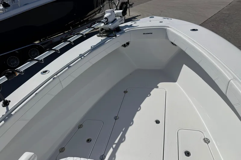Slide: The Image of 2025 Bluewater 25t boat deck, featuring sleek white design and modern fittings. - 19