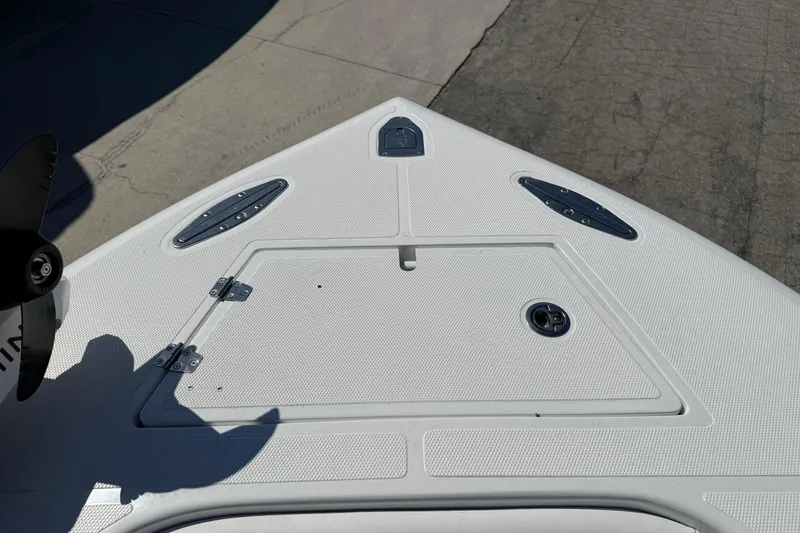 Slide: The Image of Bow of 2025 Bluewater 25t boat with storage hatch and cleats. - 22