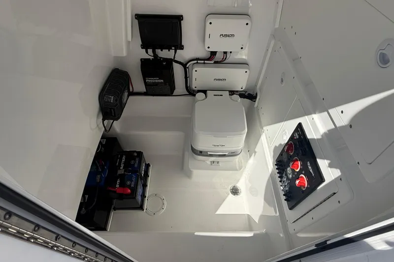 Slide: The Image of Interior of 2025 Bluewater 25t boat featuring marine electronics and equipment. - 25