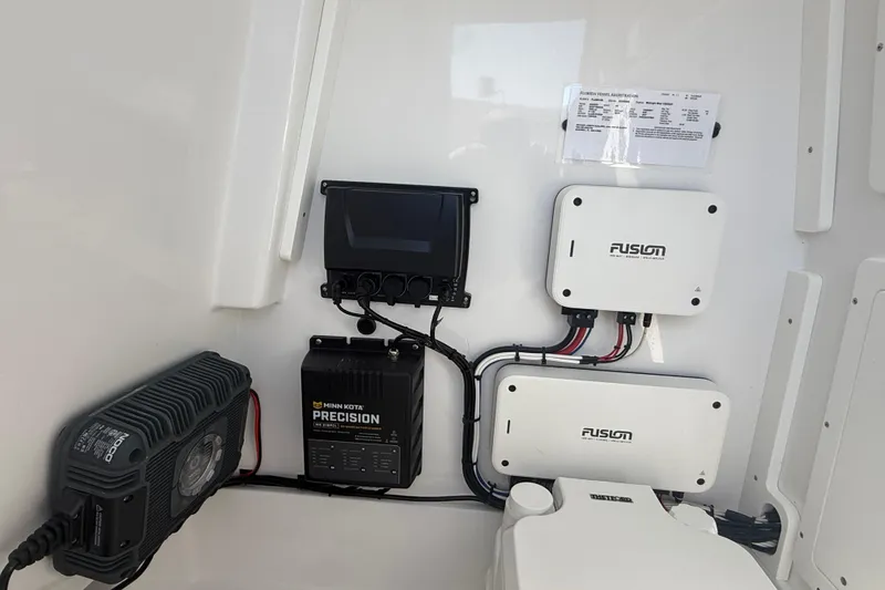 Slide: The Image of Electrical system setup in a 2025 Bluewater 25t boat, featuring Minn Kota Precision charger. - 29