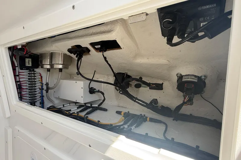 Slide: The Image of Electrical compartment of a 2025 Bluewater 25t boat, showcasing wiring and components. - 30