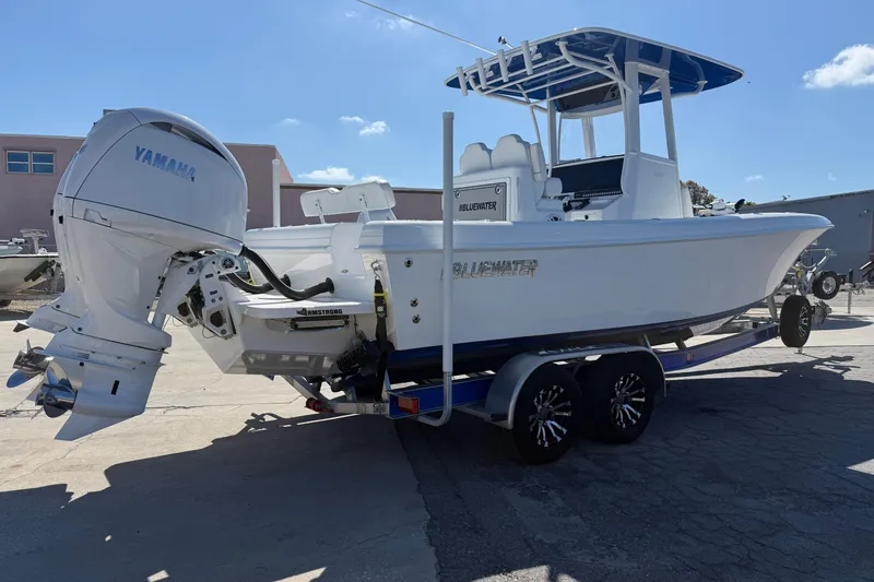Slide: The Image of 2025 Bluewater 25t boat with Yamaha engine on trailer, parked outdoors. - 36