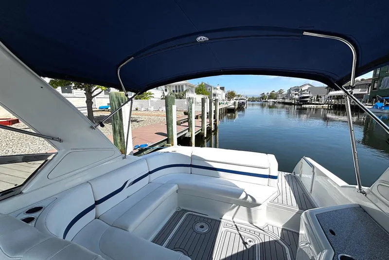 Slide: The Image of 2004 Formula 330 Sun Sport boat interior with waterfront view. - 11