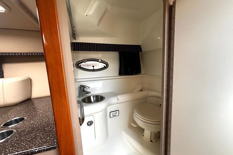 Slide: The Image of Interior of 2004 Formula 330 Sun Sport boat bathroom with sink and toilet. - 19