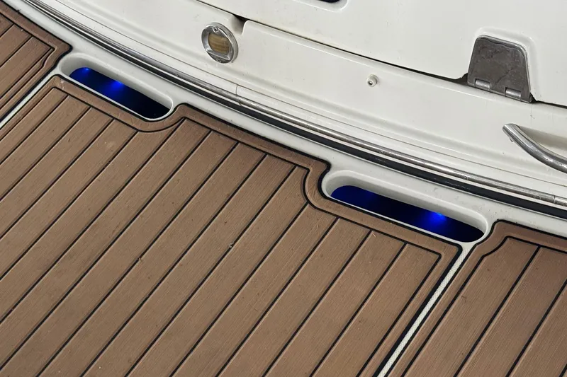 Slide: The Image of Teak deck with blue LED lights on 2006 Chaparral 330 Signature boat. - 12