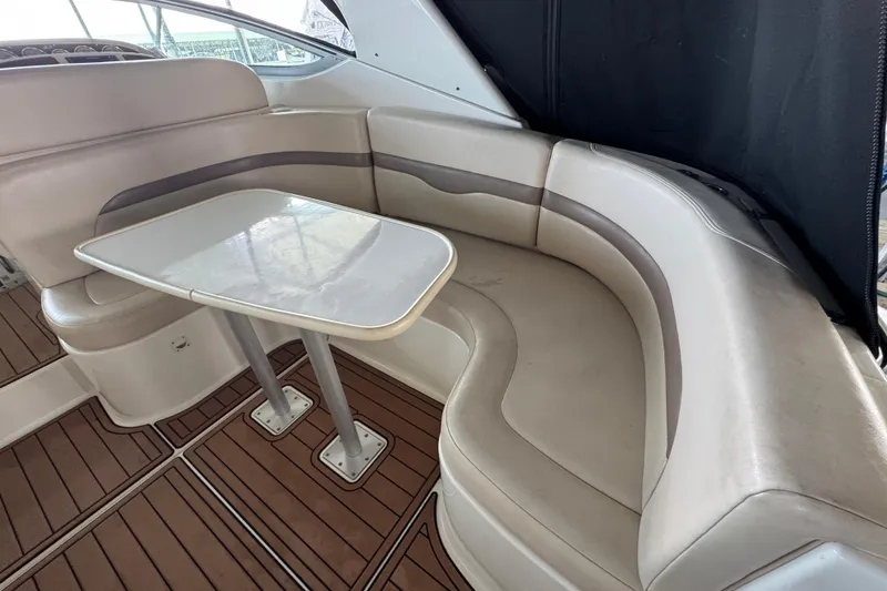 Slide: The Image of 2006 Chaparral 330 Signature boat interior with curved seating and table. - 15