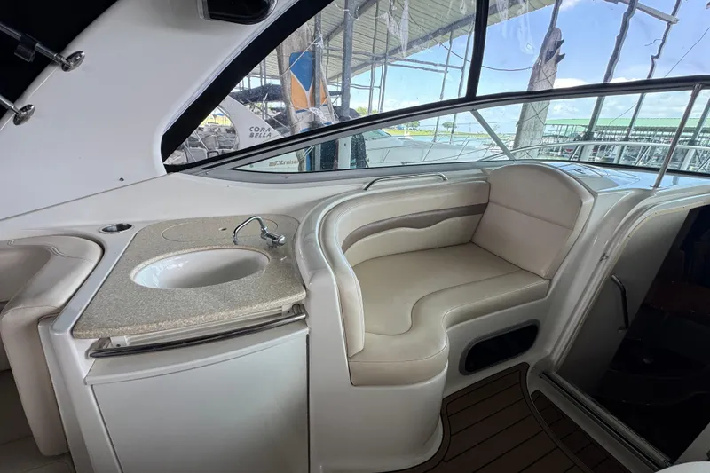 Slide: The Image of Interior of 2006 Chaparral 330 Signature yacht with seating and sink area. - 18