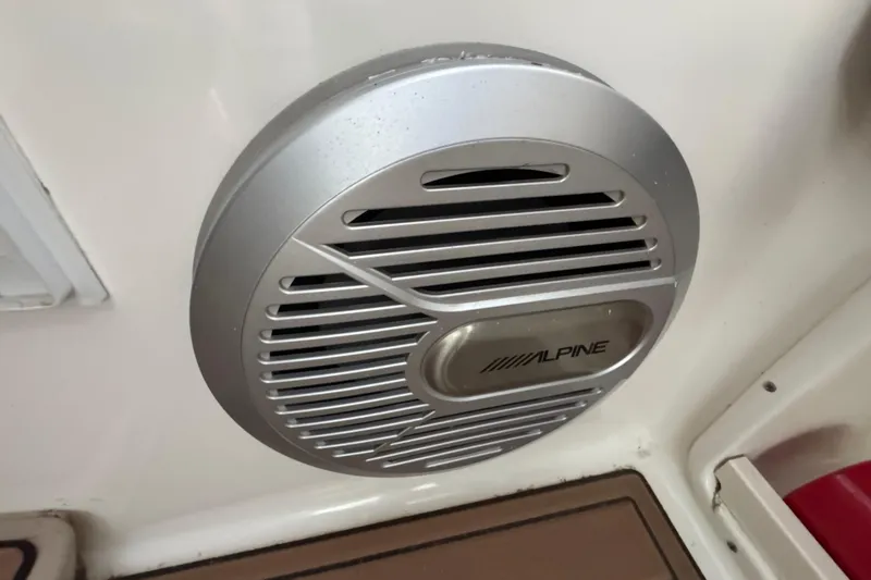Slide: The Image of Alpine speaker installed on a 2006 Chaparral 330 Signature boat interior. - 21