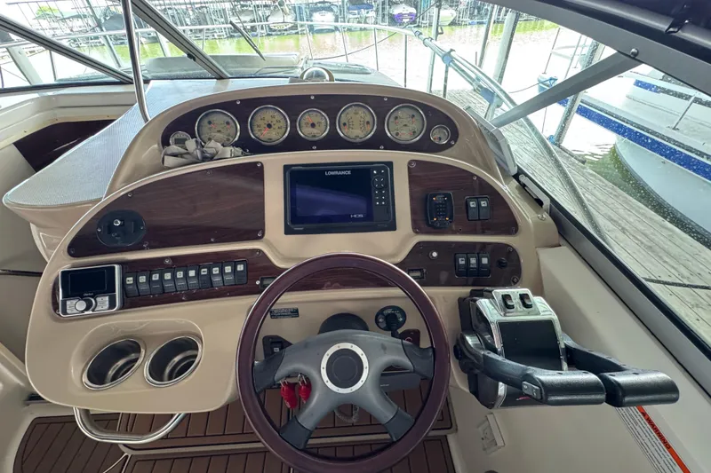 Slide: The Image of Cockpit of 2006 Chaparral 330 Signature boat with steering wheel and control panel. - 22