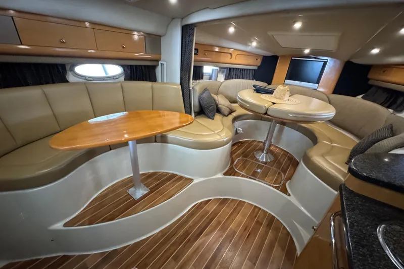 Slide: The Image of Luxurious interior of 2006 Chaparral 330 Signature yacht with elegant seating and wooden flooring. - 28