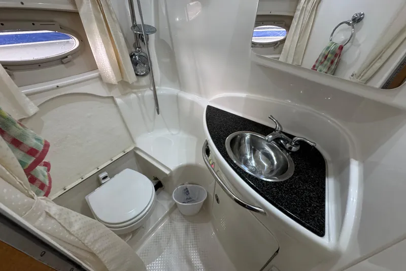 Slide: The Image of Bathroom interior of 2006 Chaparral 330 Signature boat with sink, toilet, and shower. - 30