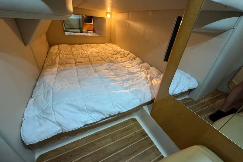 Slide: The Image of Cozy cabin interior of 2006 Chaparral 330 Signature with comfortable bedding. - 32