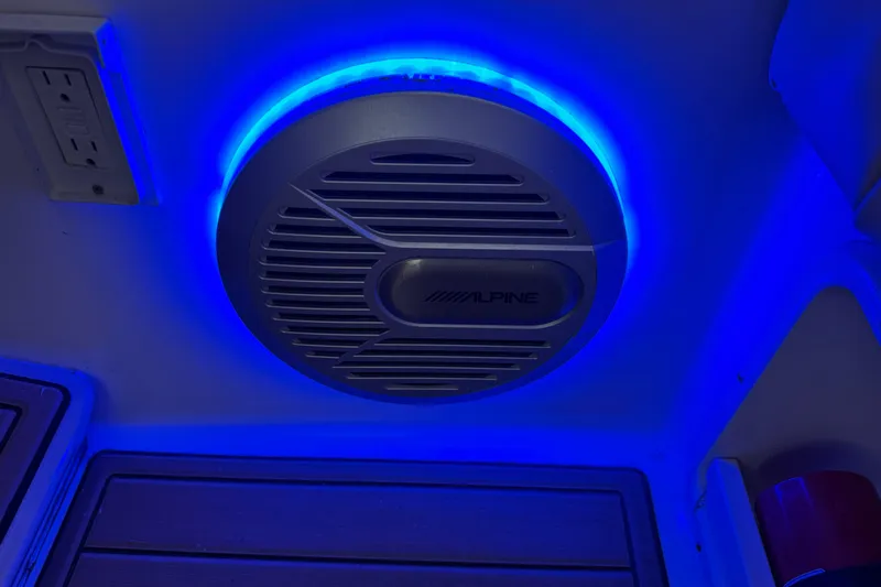 Slide: The Image of Alpine speaker with blue LED lighting in 2006 Chaparral 330 Signature boat interior. - 33