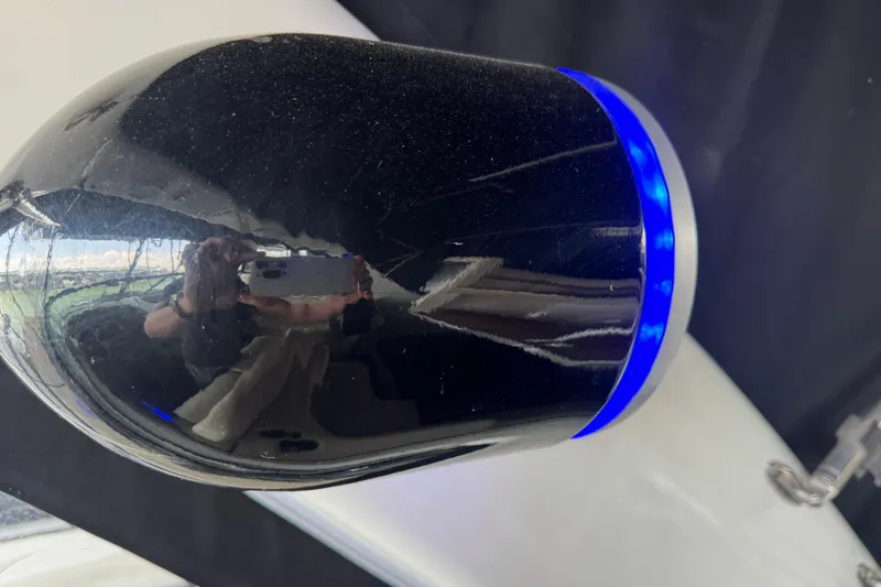 Slide: The Image of Close-up of a 2006 Chaparral 330 Signature boat's reflective surface with blue LED lighting. - 34