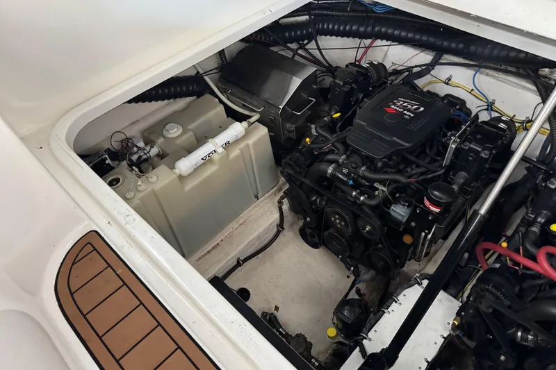 Slide: The Image of Engine compartment of a 2006 Chaparral 330 Signature boat, featuring a Volvo Penta engine. - 45