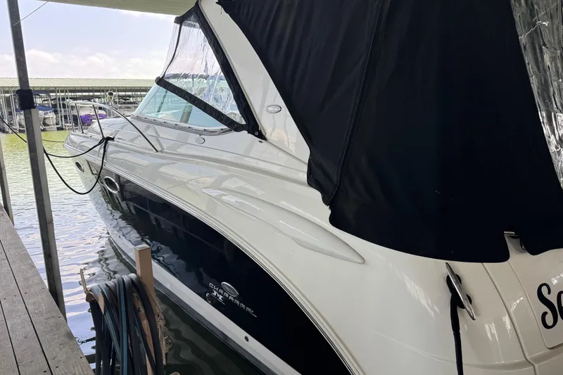 Slide: The Image of 2006 Chaparral 330 Signature boat docked with black canopy cover. - 6