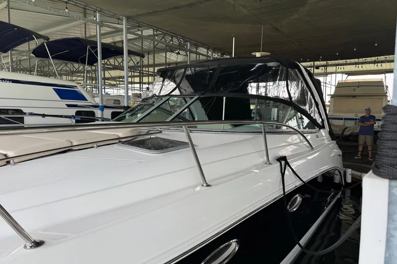 Slide: The Image of 2006 Chaparral 330 Signature boat docked in a covered marina. - 7