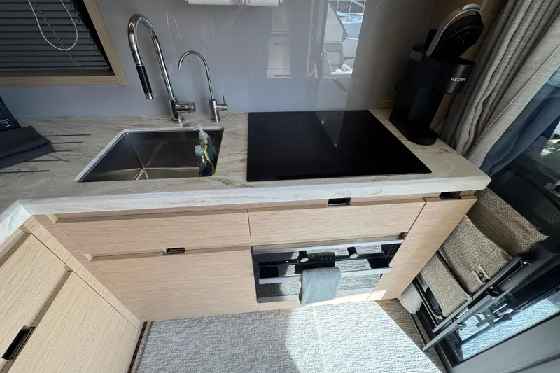 Slide: The Image of Modern kitchen in 2020 Beneteau Monte Carlo 52 yacht with sink and stovetop. - 15