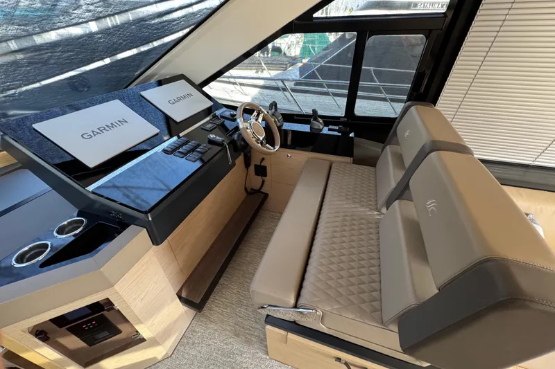 Slide: The Image of Luxurious helm of 2020 Beneteau Monte Carlo 52 yacht with Garmin navigation displays. - 19