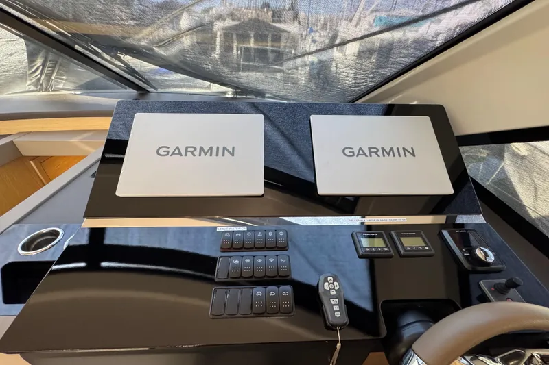 Slide: The Image of Control panel of 2020 Beneteau Monte Carlo 52 with dual Garmin displays. - 23