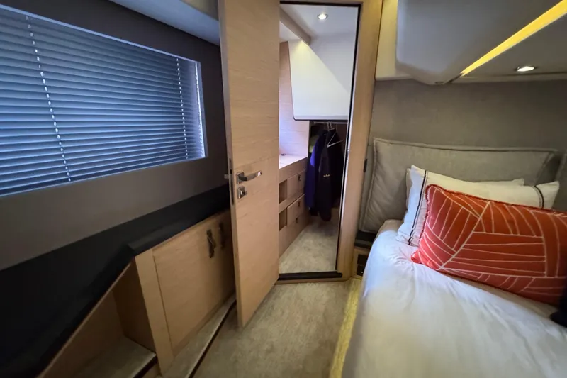 Slide: The Image of Luxurious bedroom interior of 2020 Beneteau Monte Carlo 52 yacht with modern furnishings. - 28