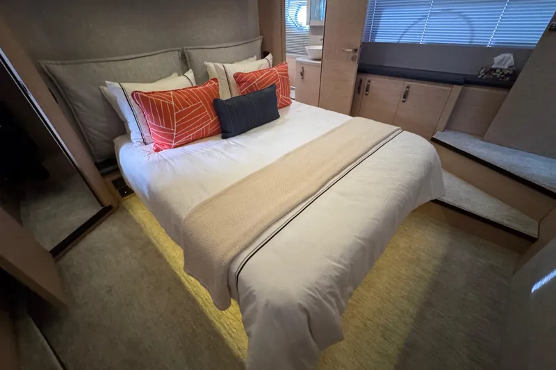 Slide: The Image of Luxurious bedroom interior of 2020 Beneteau Monte Carlo 52 yacht with modern decor. - 29