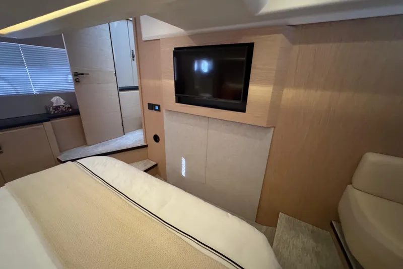 Slide: The Image of Luxurious interior of 2020 Beneteau Monte Carlo 52 yacht with TV and modern design. - 30